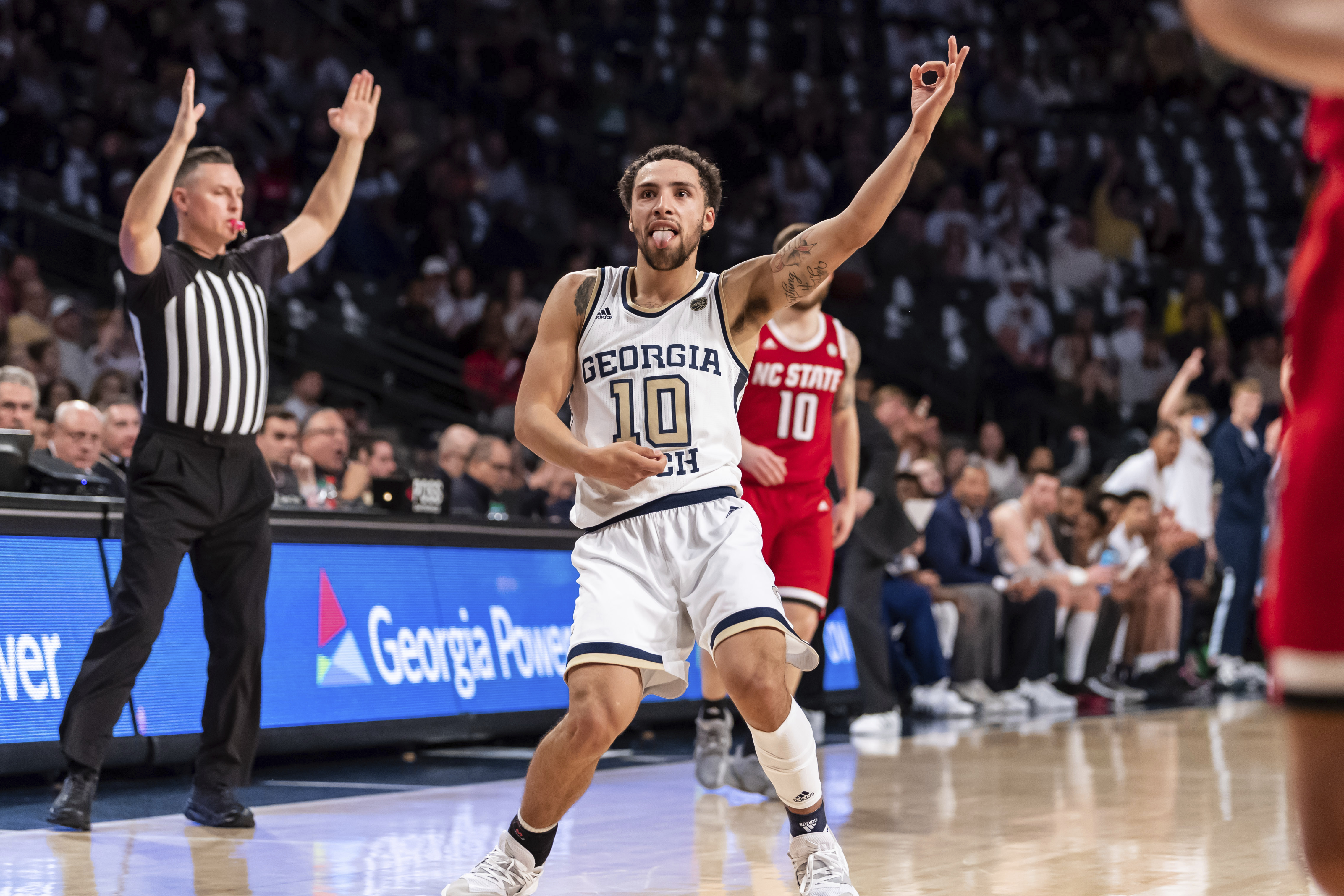 jose alvarado 3 pointer celebration after scoring in a georgia tech game